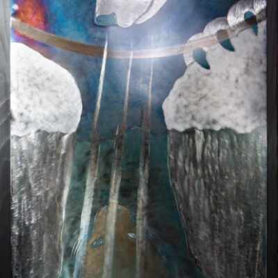 A polar bear watches patienly above a seals breiathing hole, hidden by the bright rays of the winter sun.