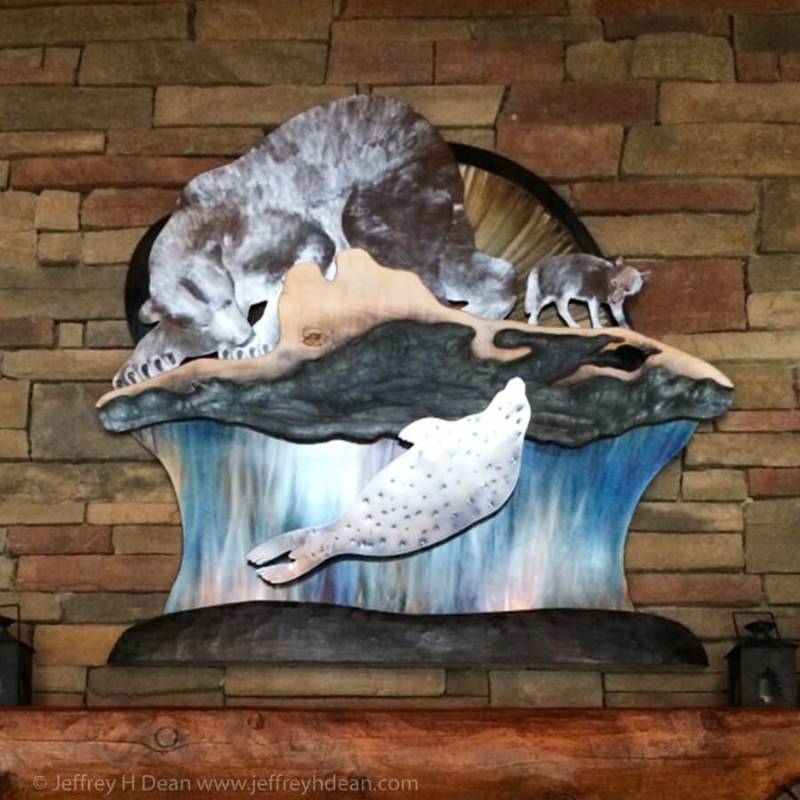 A lone polar bear and arctic fox watch silently as a seal rises to it's breathing hole in this layered metal and wood wall art..