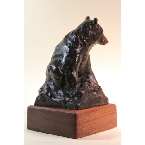Bronze sketch of seated black bear.