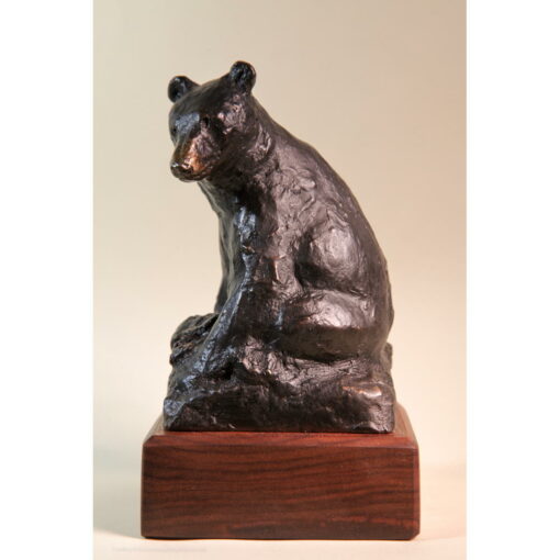 Bronze sketch of seated black bear.