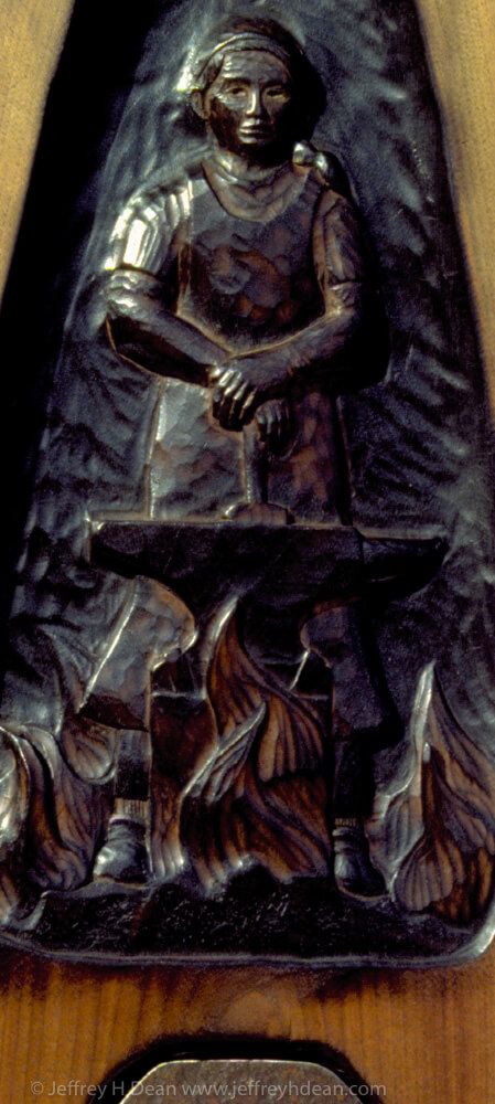 Black walnut relief carving of blacksmith with poem.