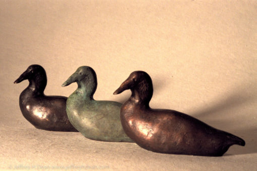 Small bronze duck sculpture