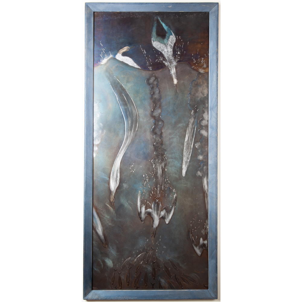 Metal wall art in engraved and heat tinted steel depicting an underwater scene of diving gannet birds.