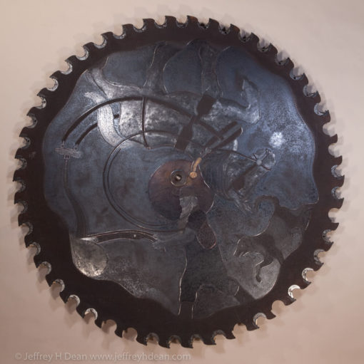 Farmer plowing with his horse in the early morning moonlight. Engraved steel sawblade with heat tints.