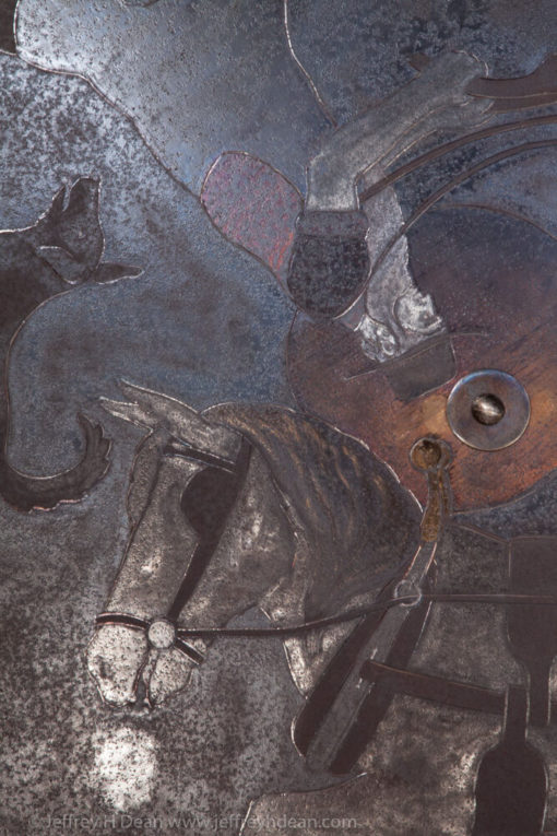 Farmer plowing with his horse in the early morning moonlight. Engraved steel sawblade with heat tints.