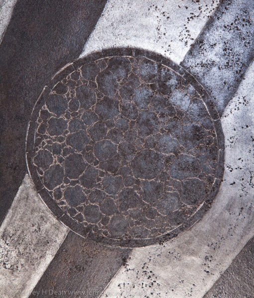 Earth, air, fire and water; the resources of the smith. Engraved steel sawblade of blacksmith in the forge.