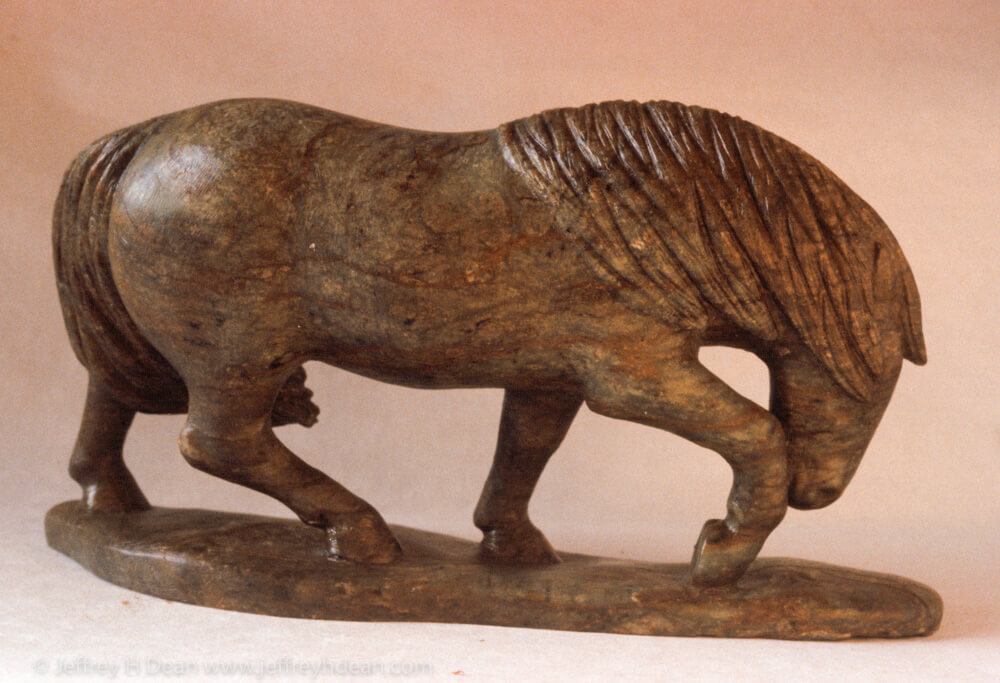 Soapstone carving of horse in the wind.