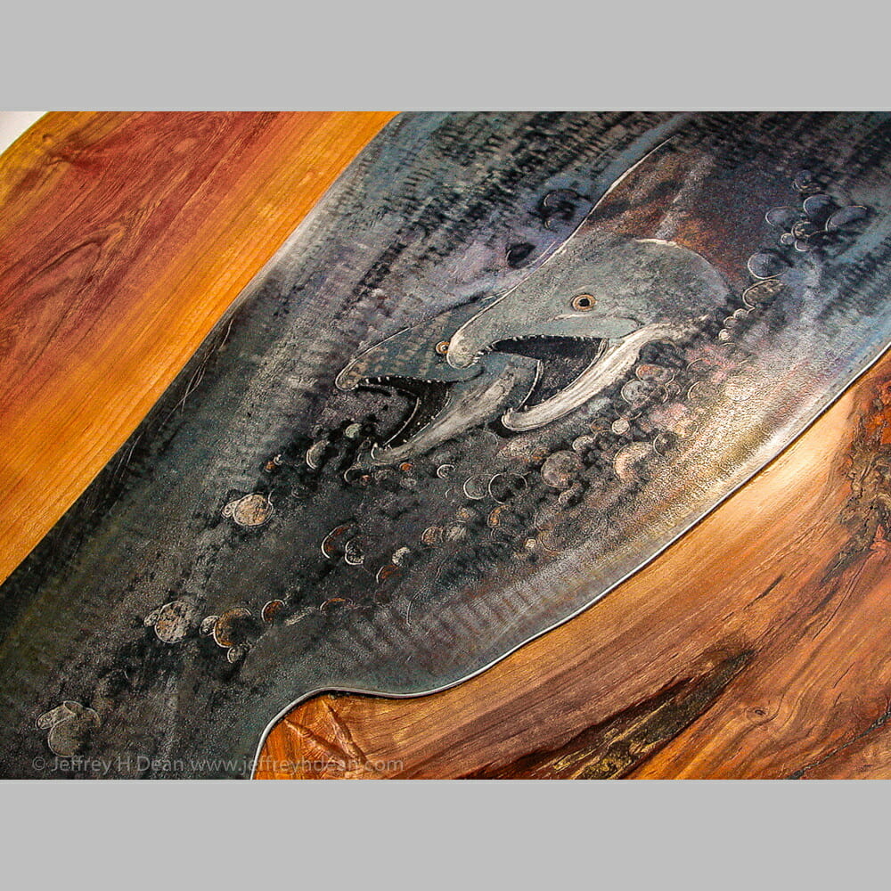 Lifecycle in salmon stream. Engraved steel with heat tints on cherry table.