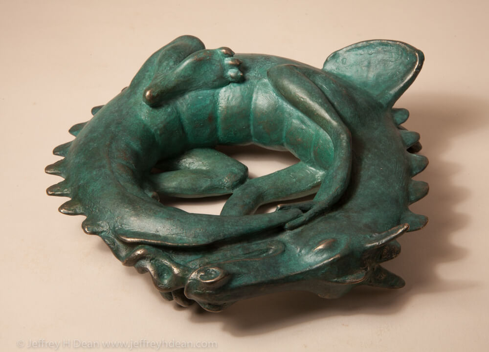 Sleeping baby dragon in bronze.