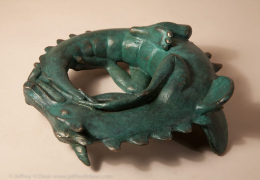 Sleeping baby dragon in bronze.