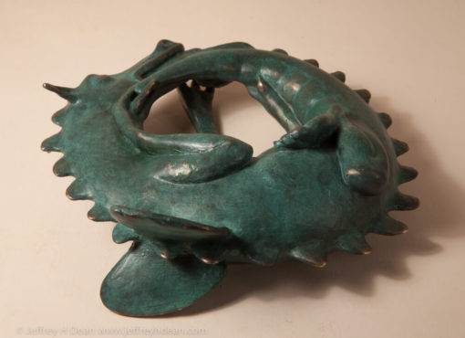 Sleeping baby dragon in bronze.