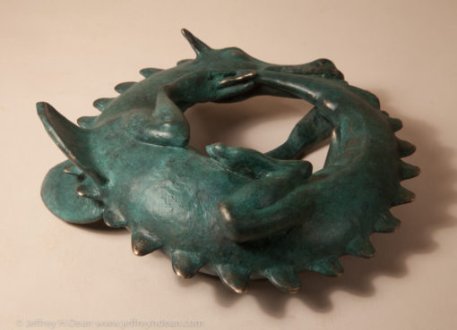 Sleeping baby dragon in bronze.