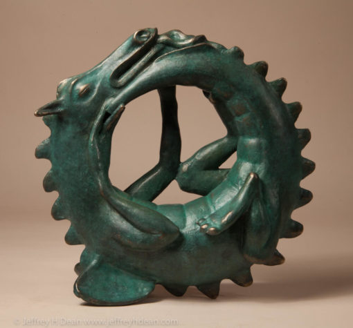 Sleeping baby dragon in bronze.