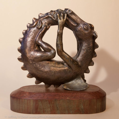 Sleeping baby dragon in bronze.